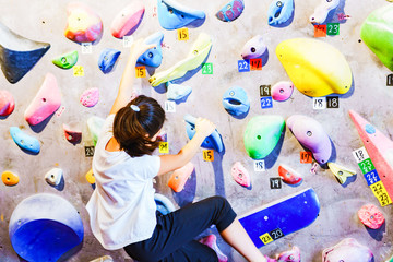 Young girl and landscape of bouldering climbing studio in Japan