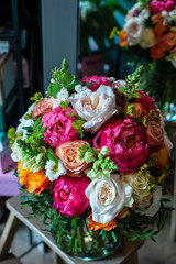 the most beautiful flowers, magnificent bouquets of flowers on the leg in the interior of the restaurant for a festive floristry store or wedding salon for the bride or groom, a bridal bouquet, butane