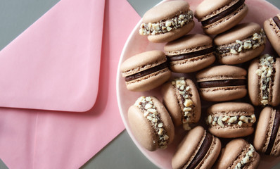 Envelope and macarons.