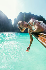 Beautiful woman making an excursion to phi phi island and maya beach in Thailand