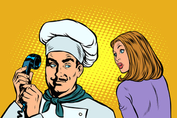 chef on the phone, a woman client listens