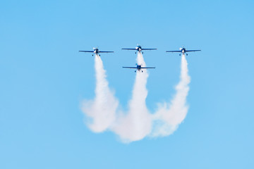 Four Planes Flying in a Beautiful Cross Formation at an Airshow
