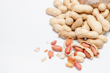 Large peeled peanuts close-up of beans in the shell. Unpeeled peanuts in the shell. Peanuts, for background or texture. Growing organic protein