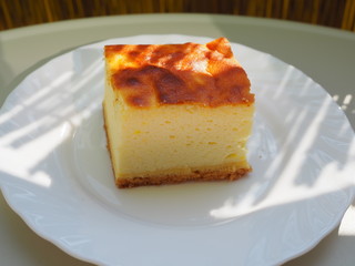 Piece of cake on white plate