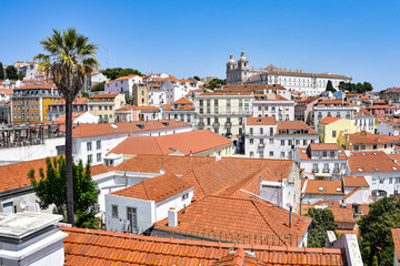 Lisbon, Portugal - July 23, 2019: Summertime views across the rooftops of the Alfama district