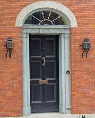 Old wooden door on brick building