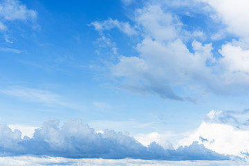 Naklejka na ściany i meble Blue sky background with clouds in sunny day.