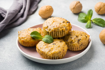 Oatmeal vegetarian muffins with blueberries and nuts on a plate. Concept healthy Breakfast.
