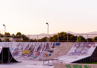 Photo of skatepark in the summer with white sky