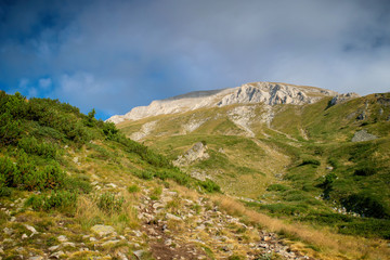 Fototapeta premium Path between Vihren hut and Vihren peak in Pirin national park, near Bansko, Bulgaria