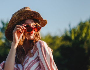 Portrait  of a young blond country girl with vintage glasses
