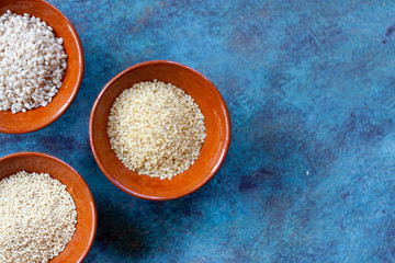 grains and seeds in ceramic bowls. Healthy Food