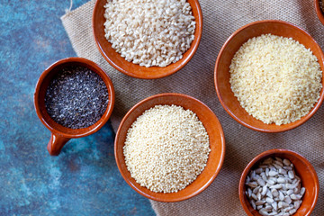 Grains and seeds in ceramic bowls