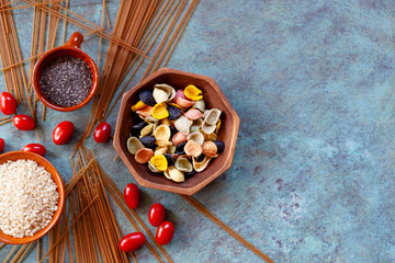 Colorful pasta and wholegrain spaguetti witn seeds 