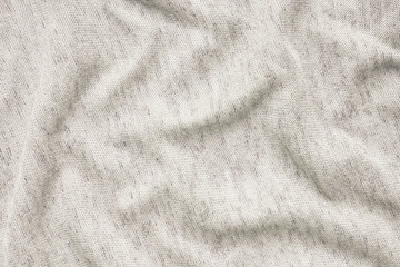 Texture of beige fabric. Background of clothing details.