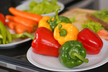 colored sweet peppers on desk in ketchen