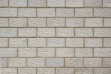 Wall of the house made of concrete blocks. Background image. Image with reduced contrast