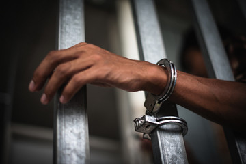 Hands of men desperate to catch the iron prison, prisoner concept - Image