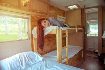 Young asian woman in a camper van