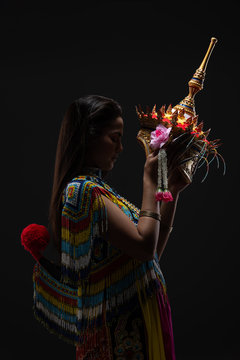 Asian woman in traditional costume of Southern Thailand. Nora dance show.hold crown touch face.