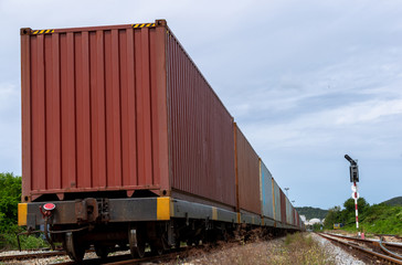 Obraz premium freight train loaded with shipping containers, Cargo train platform