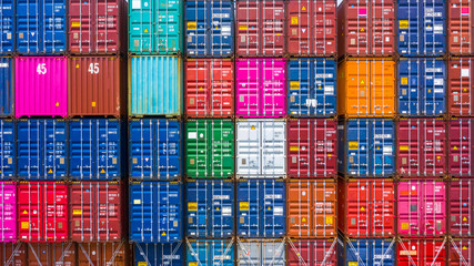 Abstract texture and background stack of freight cargo shipping containers at the docks, Stack of...