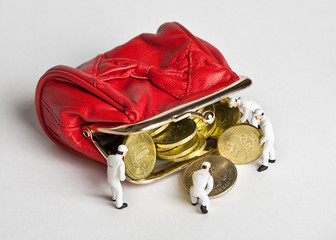 Little men to add Russian coins to the open red wallet