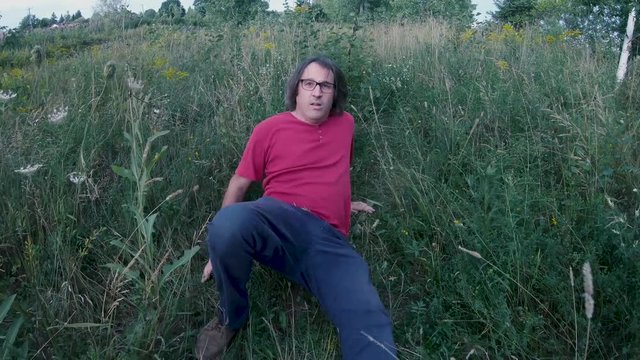 Horror scene of a man backing up being afraid of the camera POV monster serial killer concept.