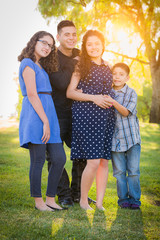 Hispanic Pregnant Family Portrait Outdoors