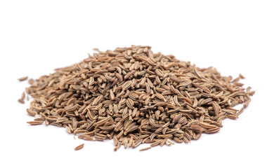 Pile of cumin seeds isolated on white background