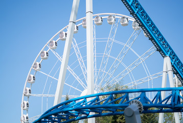 Amusement park rides with a very blue sky as background