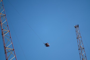 Amusement park rides with a very blue sky as background