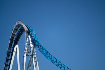 Amusement park rides with a very blue sky as background