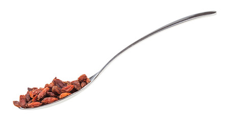 side view of spoon with goji berries isolated