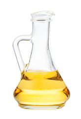 side view of glass jug with vegetable oil isolated