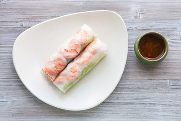 top view of Nem cuon rolls on plate on table