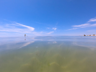 Ocean clear water and blue sky. Algarve Portugal