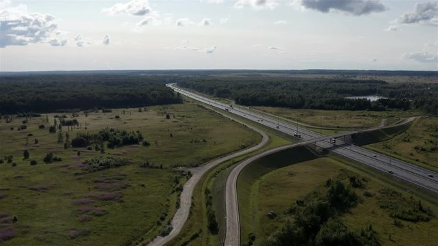 bends of the highway laid among the dense forest.