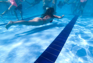 Underwater view from a women diving in a pool
