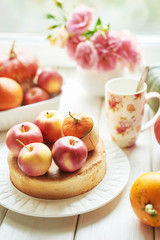 Naked Cake with Apples. Thanksgiving Day table. Happy Halloween Pumpkins, apples and flowers. Bright autumn background. Colorful autumn card. Autumn flower arrangement. Autumn bouquet