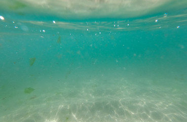 Underwater view from garbage and plastic bottles