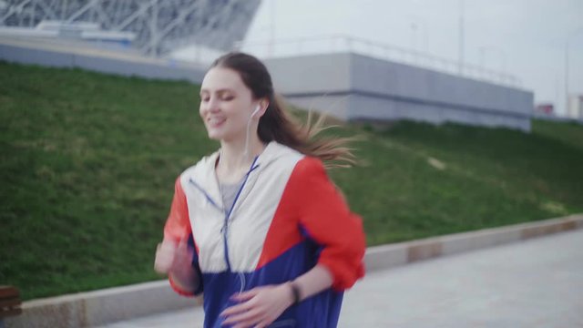 Attractive young woman athlete running in city jogging exercising enjoying healthy fitness