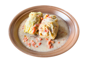 boiled cabbage rolls on ceramic plate isolated