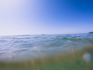Ocean clear water and blue sky. Algarve Portugal