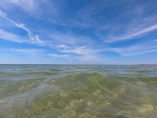 Ocean clear water and blue sky. Algarve Portugal