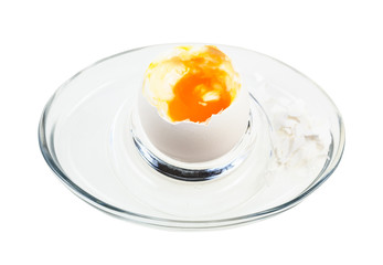 open boiled white egg in glass egg cup isolated