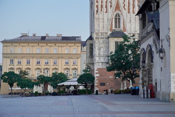 Fototapeta na wymiar old square with town hall and summer terrace at dawn waiting for tourists