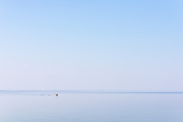 Fishermen in a boat on the lake.