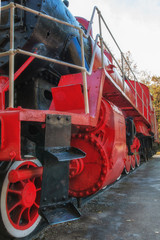 vintage red steam locomotive for rail cars