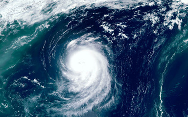 Super typhoon over the ocean. The eye of the hurricane. View from outer space  Some elements of...